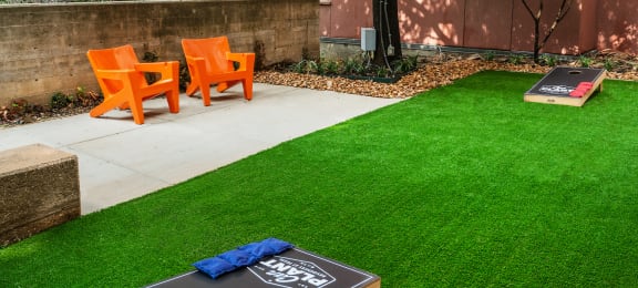 Outdoor game area at The Can Plant Residences at Pearl, San Antonio, TX 78215