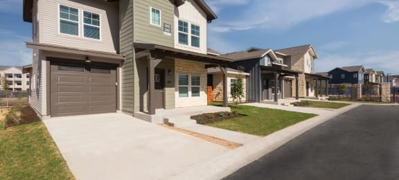 new homes on the corner of a street in a subdivision