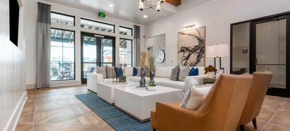the preserve at ballantyne commons living room with white couches and chairs