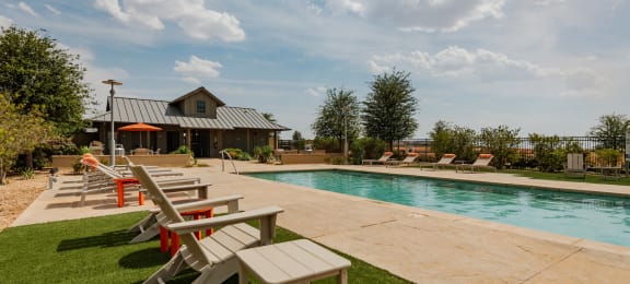 take a dip in the pool at the whispering winds apartments in pearland, tx