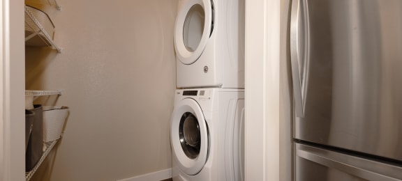 a washer and dryer in a small laundry room
