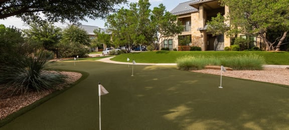 a putting green in front of a building