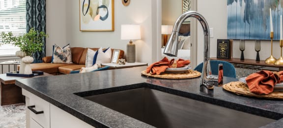 a kitchen with a sink and a faucet