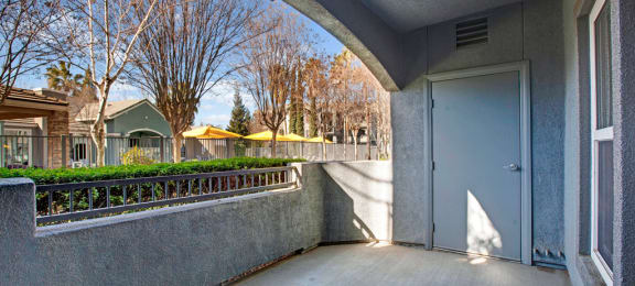 the entrance to a condo building with a blue door