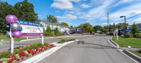 apartment sign with flowers