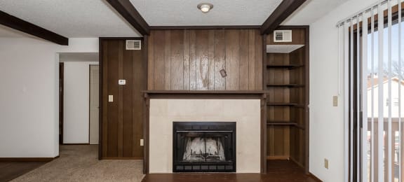 West One Bedroom Living Room and Fireplace at Raintree Apartments, Topeka, KS, 66614