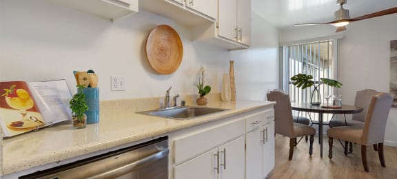 Kitchen Sink, Dishwasher, and Dining Room at Three Crown Apartments, Alameda, CA, California, 94501