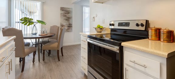 Fitted Kitchen With Island Dining at Three Crown Apartments, Alameda, California
