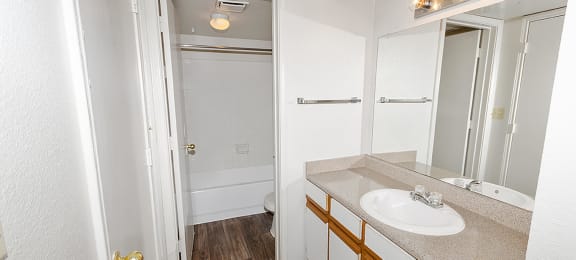 Bathroom with vanity lighting at Valley Ridge Apartments in Lewisville TX