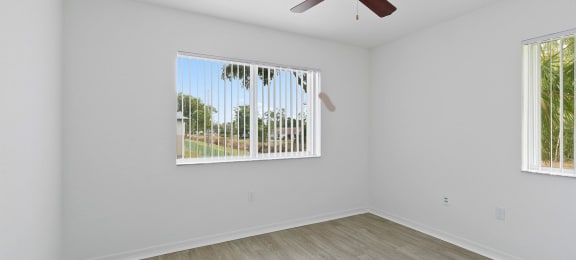 Bedroom with ceiling fan at Brenton at Abbey Park Apartments in West Palm Beach FL