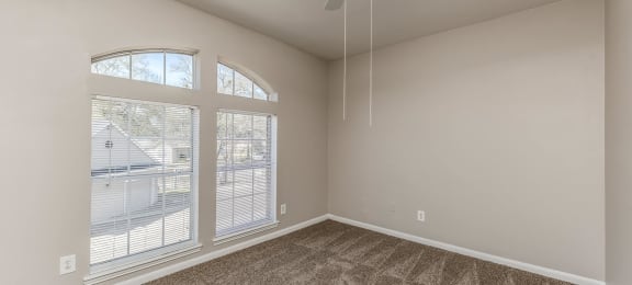 Bedroom with large window at Hollow Creek in Conroe TX