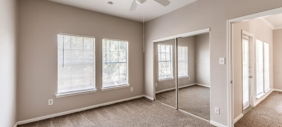 Bedroom with ceiling fan at Hollow Creek in Conroe TX