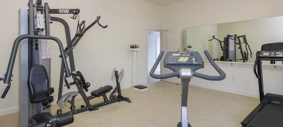 Fitness center at Whispering Oaks Apartments in Portsmouth VA