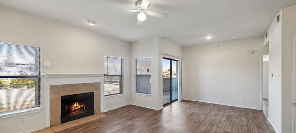 Living Room with Fireplace at Tivoli apartments in Dallas TX