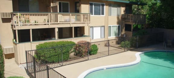 Pet-Friendly Apartments in Walnut Creek, CA - Creekside Terrace - Gated Sparkling Swimming Pool and View of Apartment Complex