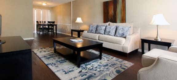 Spacious living room, spacious dining room, spacious townhome with hardwood floors, and private entries at Briarwood Apartments in Houston.