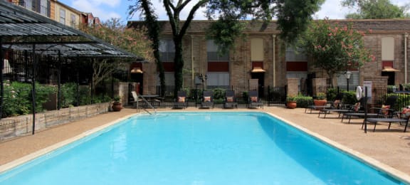 Townhome community with 4 swimming pools, beautiful landscaping, unique townhome community with a small community feel at Briarwood Apartments in Houston.