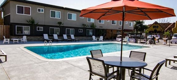 Pool with Lounge Chairs l Ethan Terrace Sacramento CA Apartments For Rent