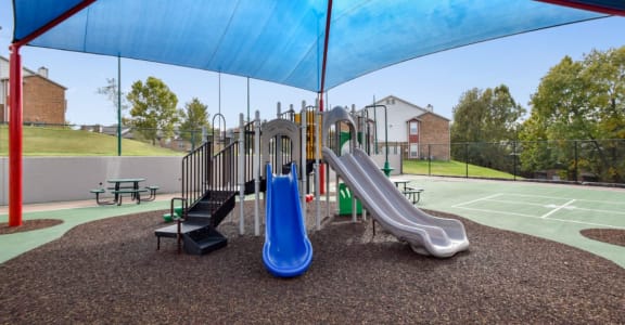 our playground is equipped with a variety of playground equipment including slides and swing sets
