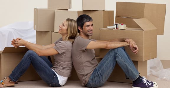 Couple with moving boxes l Blue Ravine Self Storage | Public Storage in Folsom, CA