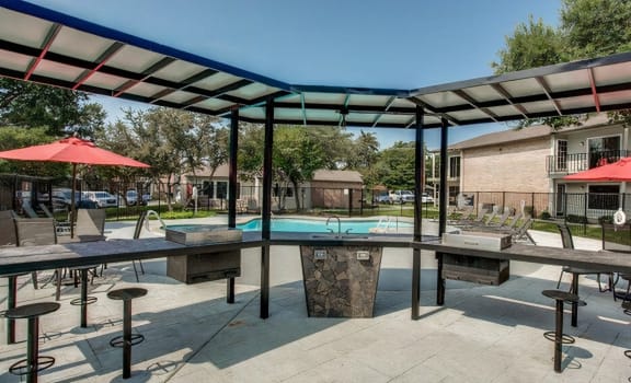 our apartments have a pool and patio with tables  at Creek on Calloway, Richland Hills, 76118