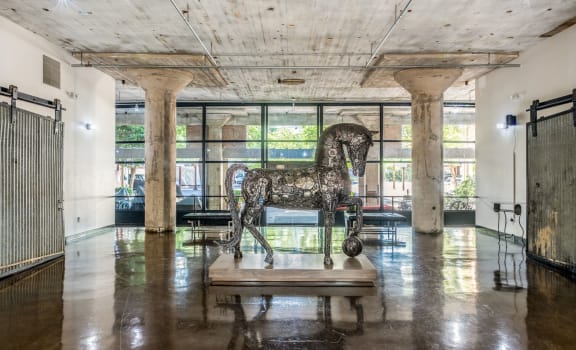 a statue of a horse in the middle of a room