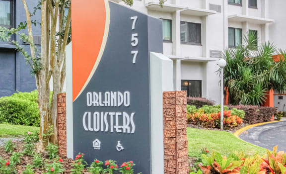 Orlando Cloisters signage beside Orlando Cloisters Senior Living Apartments