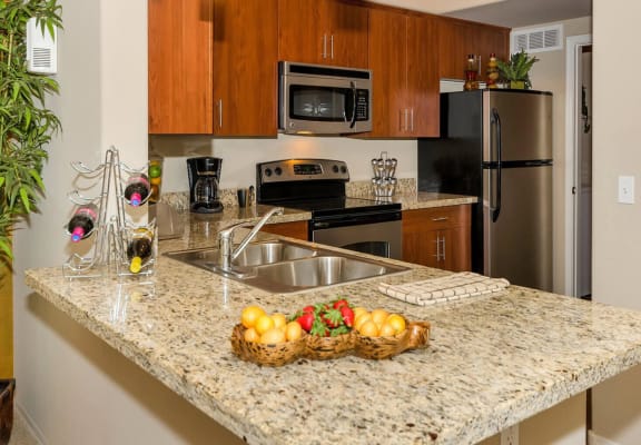 Model apartment home kitchen emphasizing countertops