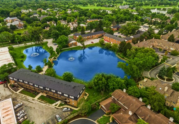 a birdseye view of a large pond in the middle of a city at The Hinsdale, Hinsdale