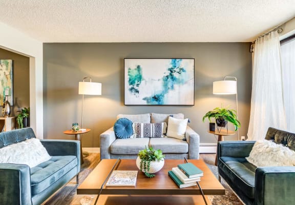 a living room with two couches and a coffee table  at ReNew at Neill Lake, Minnesota, 55344