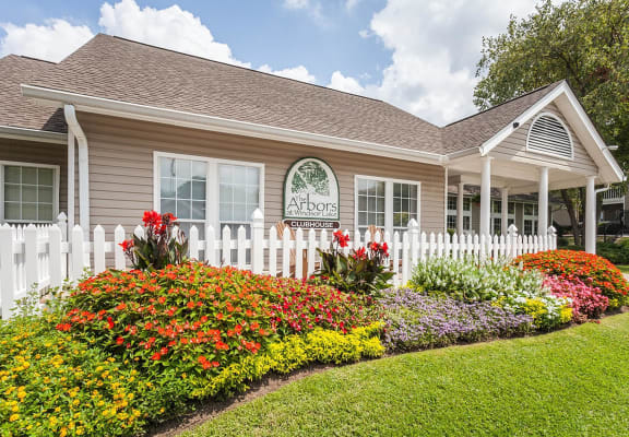 our apartments offer a beautiful yard with flowers and a white picket fence