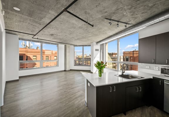 a kitchen with a large window and a view of a city at Lakeview 3200 Apartments, Chicago, IL, 60657