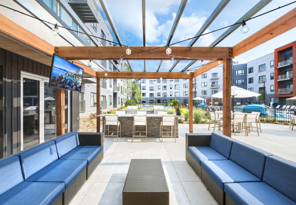Outdoor Lounge Are With TV at Union Berkley Riverfront in Kansas City, MO