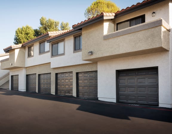a row of houses with garage doors