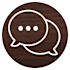 A speech bubble icon on a wooden background.