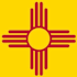 an orange and red sun logo on a yellow background