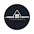 A logo for Arbor Pointe Townhomes features a house shape with a triangular roof and a chimney.