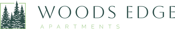A logo for Woods Edge Apartments with a pine tree and text.