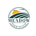 a logo of a meadow with the sun on top of it