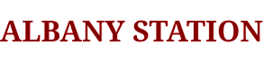 The image features the words "Albany Station" in white text on a black background.