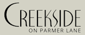 A logo for a place called Creekside on Parmer Lane.