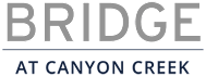 A sign that says Bridge at Canyon Creek.