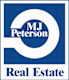 a white and blue real estate sign with the words real estate