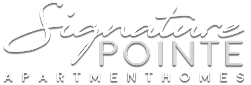 A green sign that says "Signature Pointe Apartment Homes".