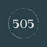 A graphic with the number 505 in the center and the words "Lofts at 505" written around the circle.