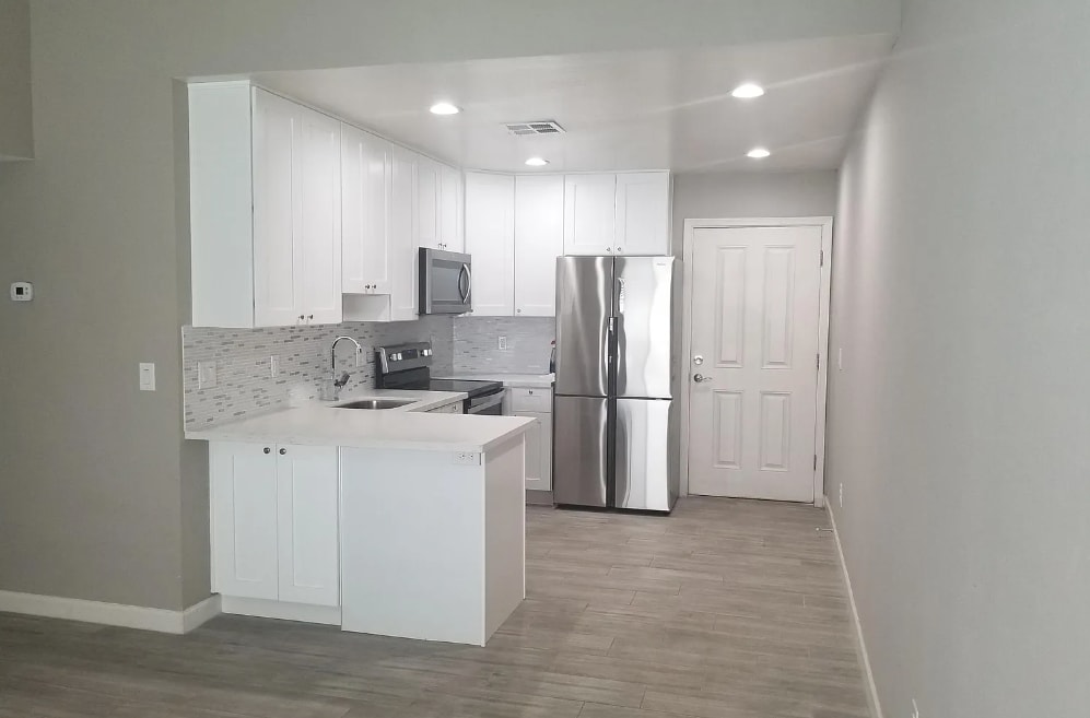 Apartment kitchen at Roma Village Apartments.