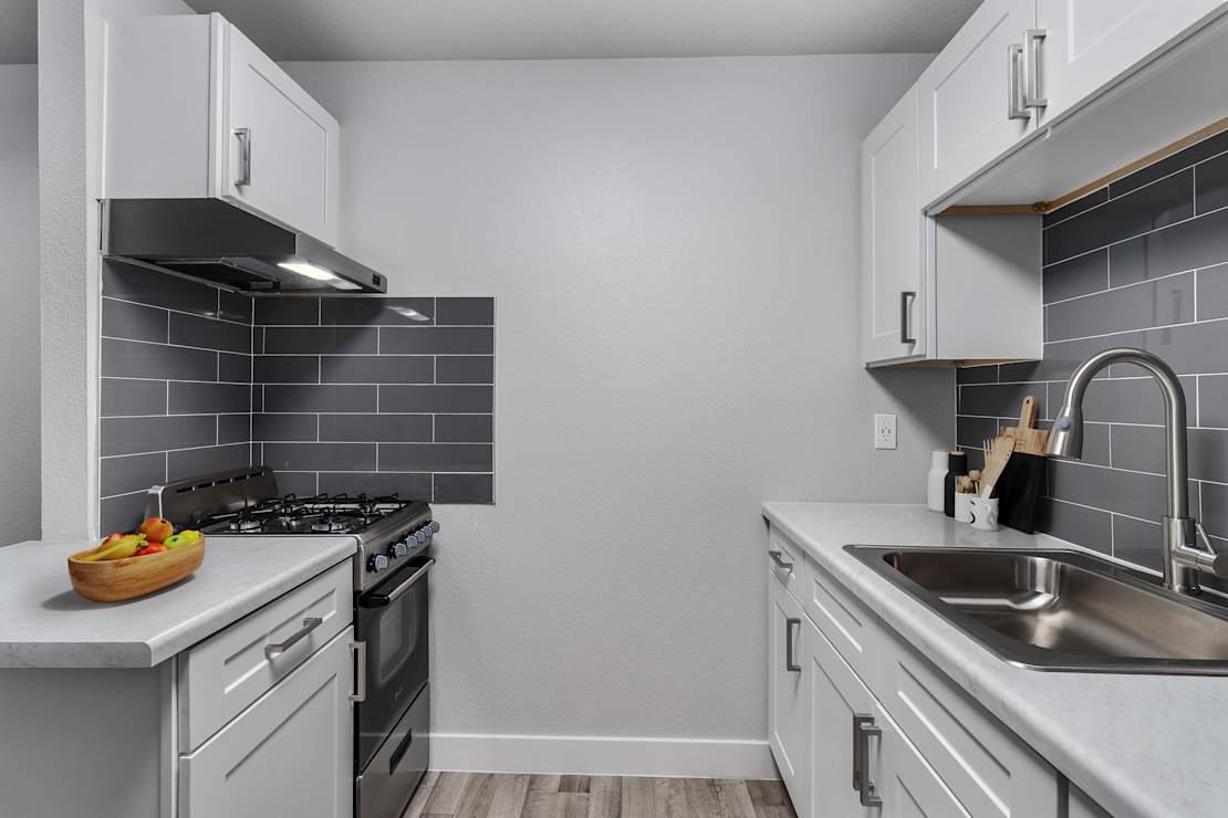 Apartment kitchen at 2025 West Apartment Homes.