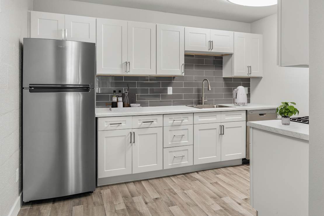 Apartment kitchen at 2025 West Apartment Homes.