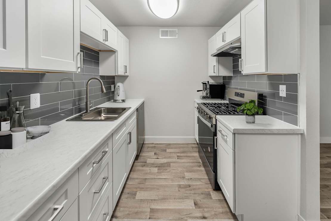 Apartment kitchen at 2025 West Apartment Homes.