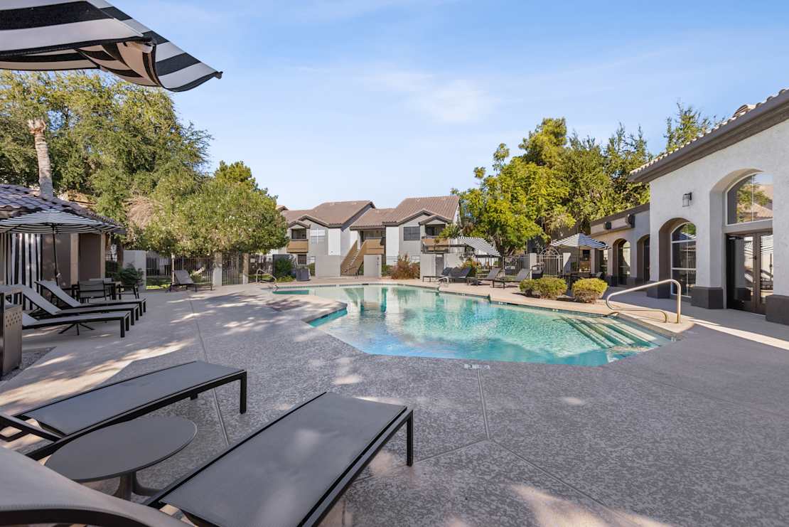 Pool and poolside area at Arcadia Cove Apartment Homes.